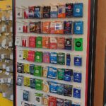 Prepaid gift card display with Roblox cards among other gaming gift cards at a retail store