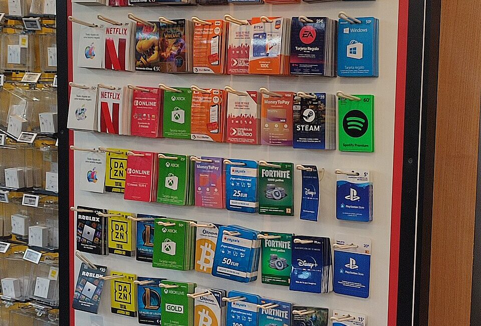 Prepaid gift card display with Roblox cards among other gaming gift cards at a retail store