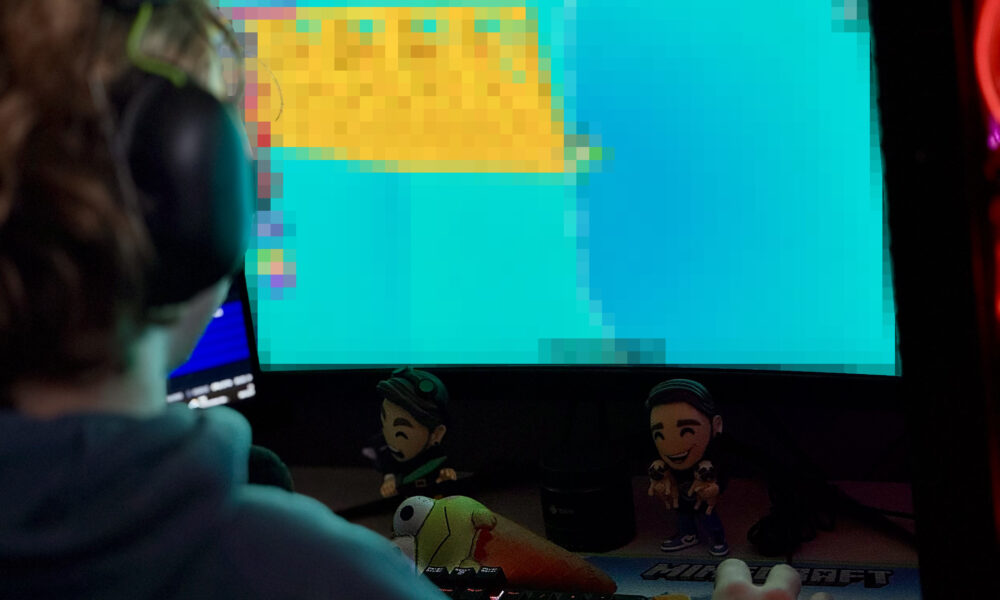 Roblox player Quinten Delaere pictured with his gaming setup; illustrative photo for Roblox communities guide