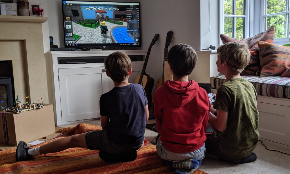 Roblox player on a computer illustrating creation and management of a Roblox Community group