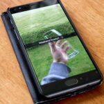 A Snapchat snap displayed on a smartphone in a photograph