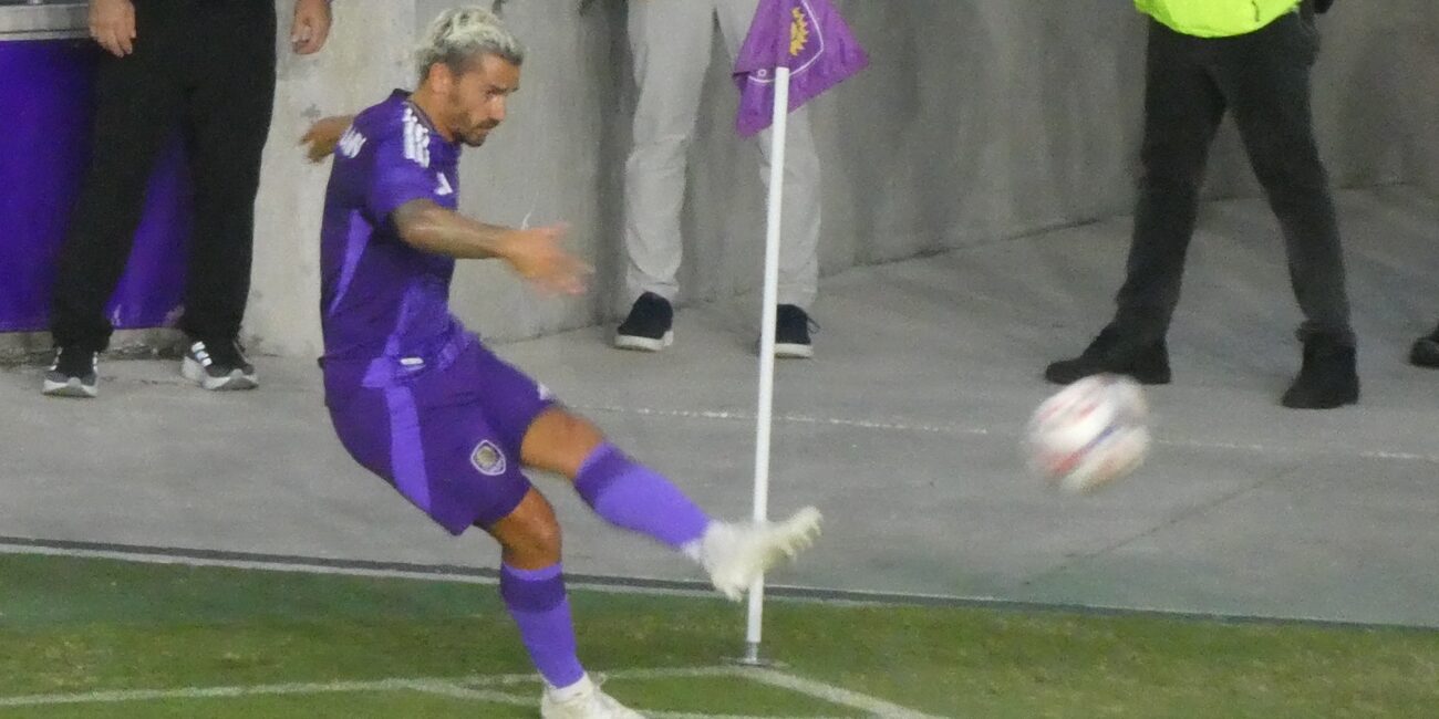 Antoine Griezmann taking a corner kick for Orlando City in an August 2026 soccer match