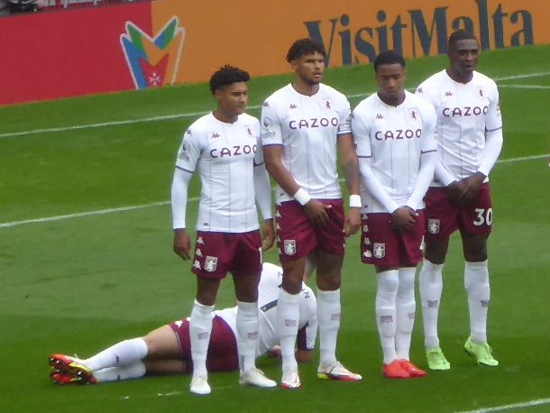 Footballers in a defensive wall with one player lying behind them during Manchester United vs Aston Villa in September 2021