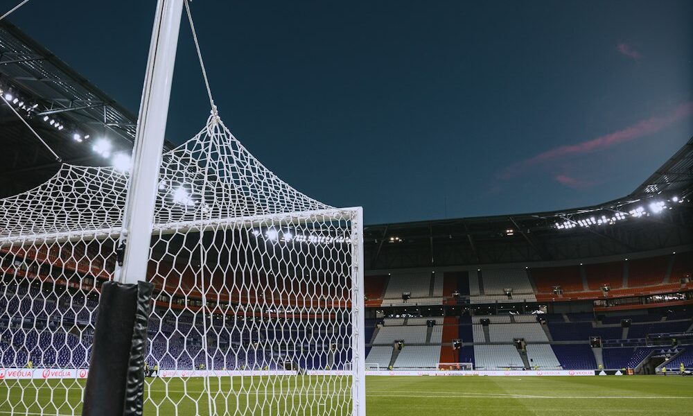 Soccer goal net at a stadium, illustrating how an own goal is recorded