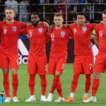 England players watch a penalty kick during the 2018 World Cup shootout against Colombia