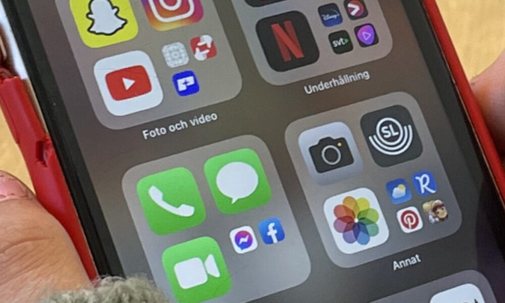 Close-up photograph of social media app icons on a smartphone, contextual image for Instagram activity status