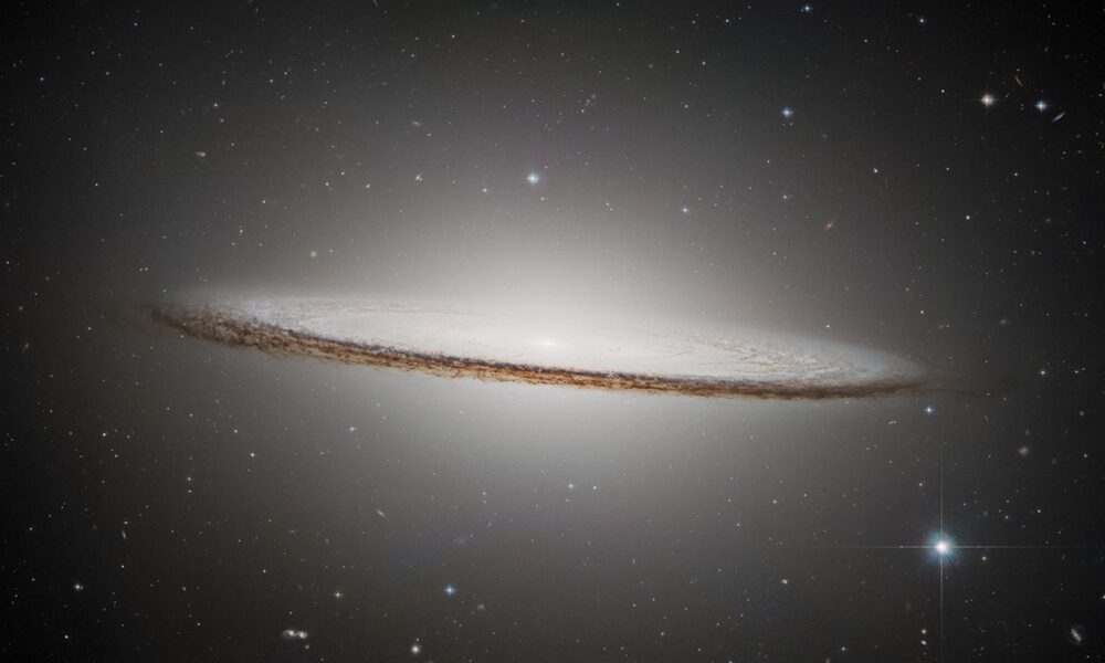 Real 2025 ESA Hubble NASA photograph of Sombrero Galaxy M104 showing huge luminous central bulge and dramatic nearly edge-on dust lane