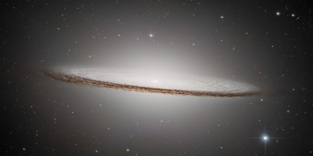 Real 2025 ESA Hubble NASA photograph of Sombrero Galaxy M104 showing huge luminous central bulge and dramatic nearly edge-on dust lane