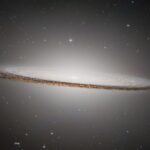 Real 2025 ESA Hubble NASA photograph of Sombrero Galaxy M104 showing huge luminous central bulge and dramatic nearly edge-on dust lane