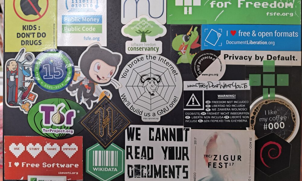 Real laptop with many stickers on its outer case