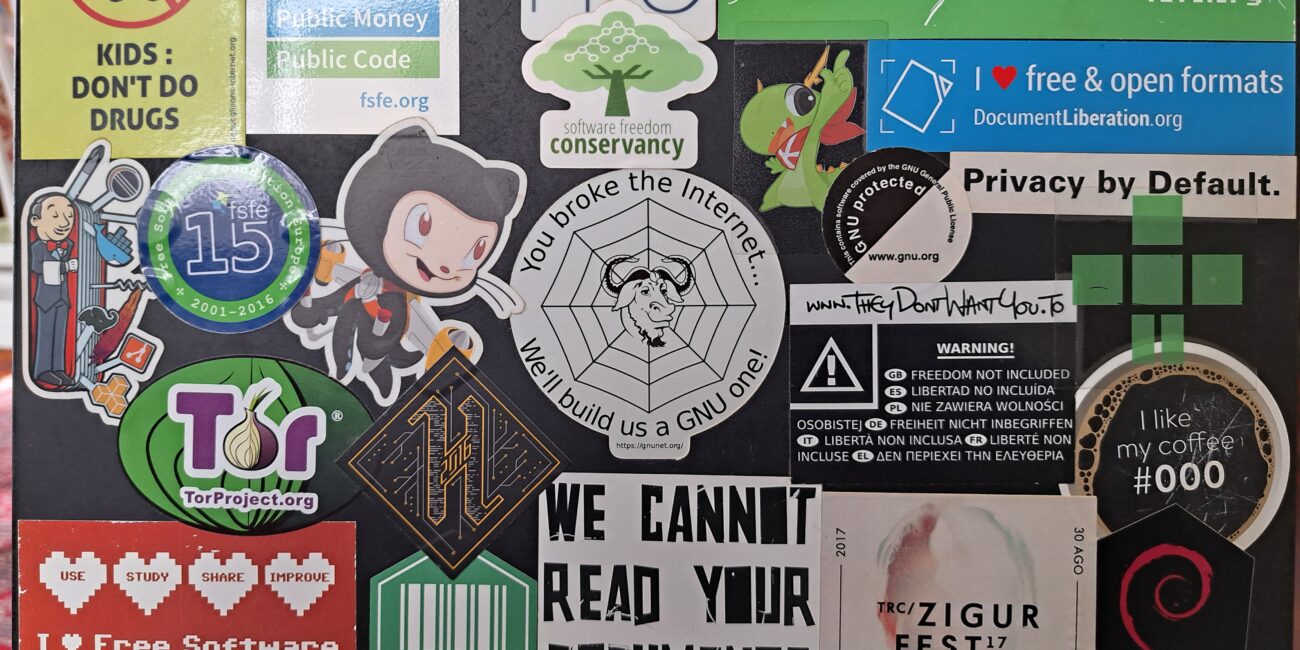 Real laptop with many stickers on its outer case