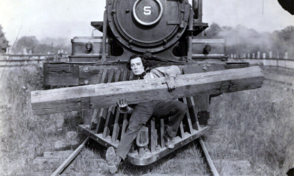 Buster Keaton on the front of a locomotive in an original 1926 photograph from The General
