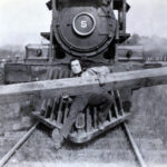 Buster Keaton on the front of a locomotive in an original 1926 photograph from The General