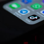 TikTok app icon displayed on a real smartphone screen
