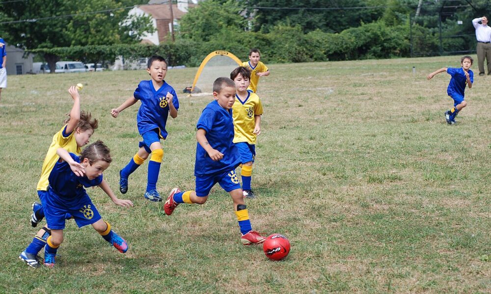 Eight-year-old children playing in a Fairfax Police Youth Club youth soccer match