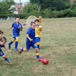 Eight-year-old children playing in a Fairfax Police Youth Club youth soccer match