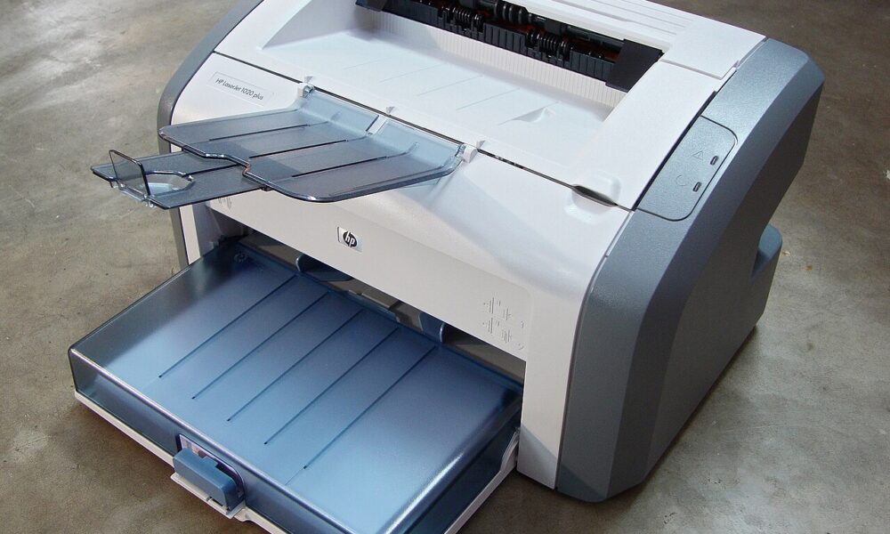 HP LaserJet laser printer photographed for Windows 11 default printer setup guide