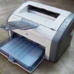 HP LaserJet laser printer photographed for Windows 11 default printer setup guide