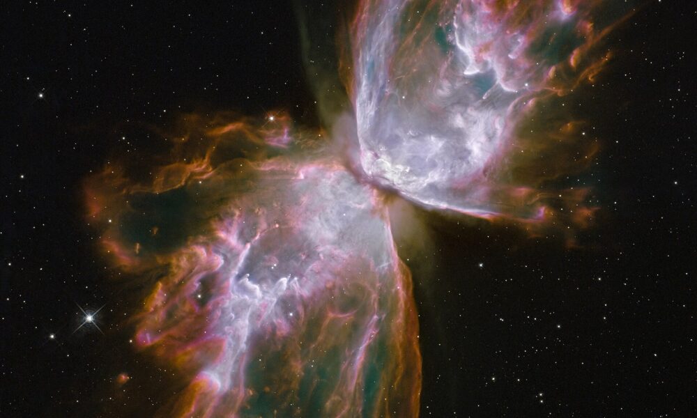Actual Hubble Space Telescope photograph of the Butterfly Nebula NGC 6302 with two butterfly-shaped glowing gas lobes in Scorpius