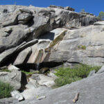 Authentic National Park Service photograph of Chilnualna Falls, with smooth granite slabs and water flowing down the steep rocky hillside in Yosemite's Wawona area