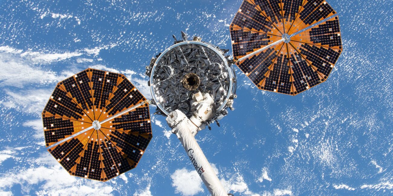 NASA Cygnus XL cargo spacecraft held by Canadarm2 near the International Space Station