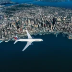 Delta Air Lines aircraft over Seattle for the October 2026 Seattle and Alaska fare sale