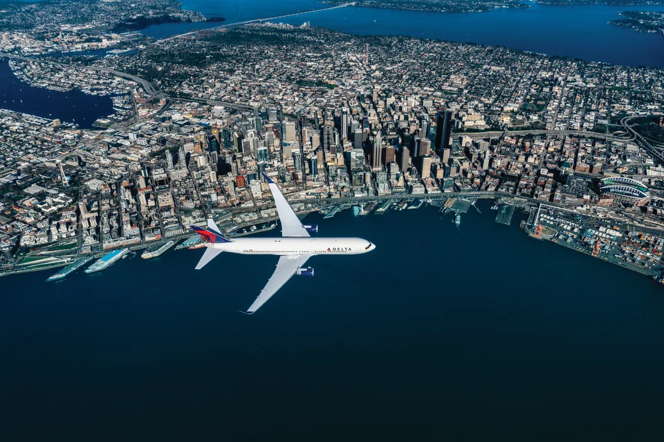 Delta Air Lines aircraft over Seattle for the October 2026 Seattle and Alaska fare sale