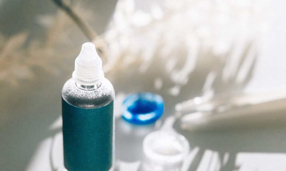 Eye Drop Recall 2026: Brands, Lot Numbers and What to Do Unbranded eye care drop bottle beside a contact lens case