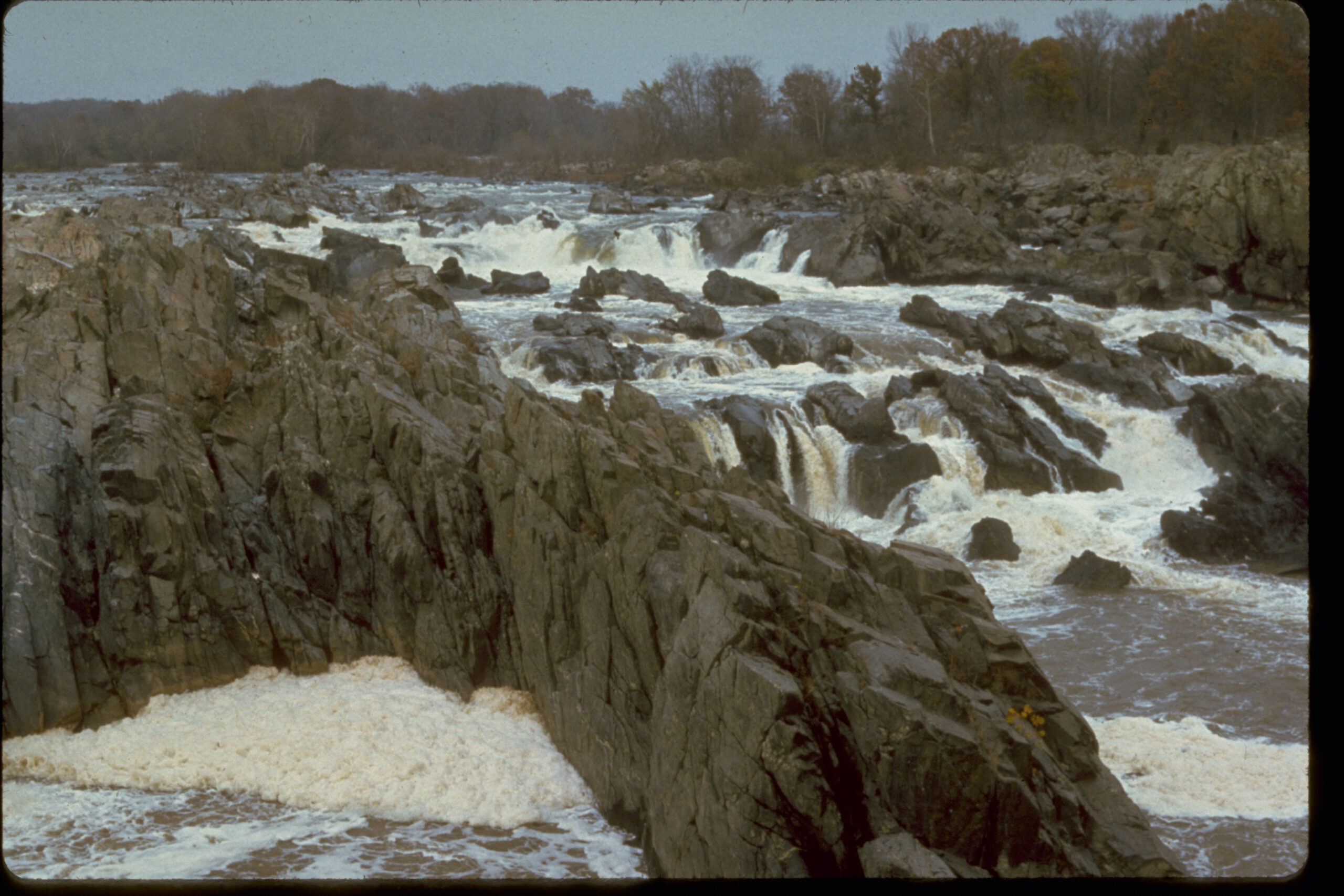 Real National Park Service photograph of the rocky Potomac River waterfalls and whitewater at Great Falls Park in Virginia