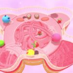 Authentic gameplay screenshot showing Kirby competing on a food-themed course in Kirby's Dream Buffet