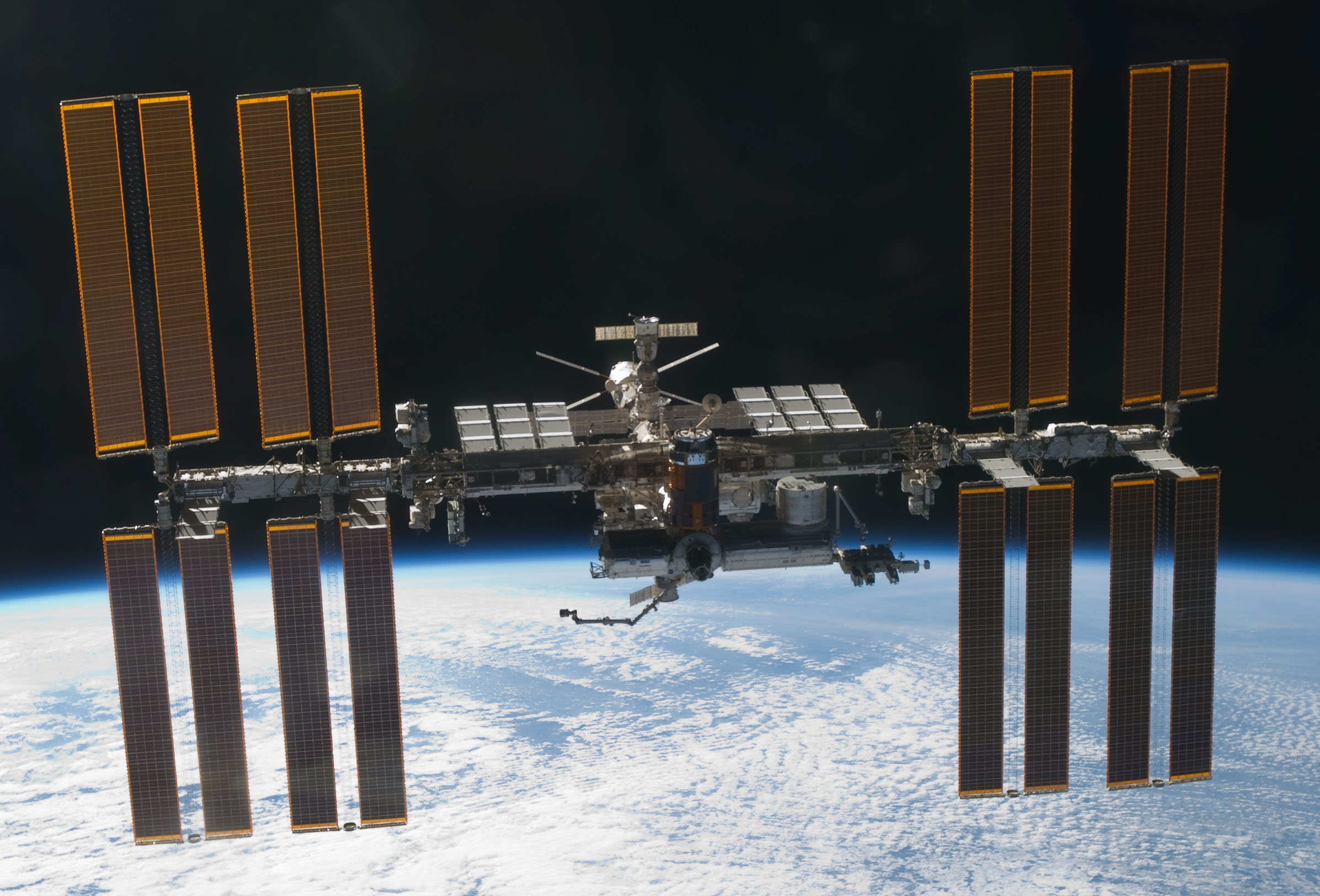 Authentic NASA photograph of the International Space Station in orbit above Earth taken from Space Shuttle Discovery on March 7 2011; historical still, not a live camera frame
