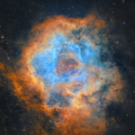 The real Rosette Nebula in Monoceros, a colorful star-forming emission nebula with a hollow central region and bright cluster NGC 2244, captured by Chuck Ayoub