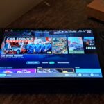 Steam Deck OLED handheld showing its SteamOS gaming home screen