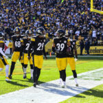 Archive 2019 Steelers and Colts game photo showing Pittsburgh defenders celebrating